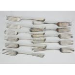 A MATCHED SET OF ELEVEN GEORGIAN SILVER FORKS Fiddle pattern with engraved dragon crest including