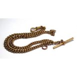 A VICTORIAN 9CT GOLD DOUBLE ALBERT WATCH CHAIN Graduated links with T bar. (approx 36cm)