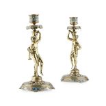 A PAIR OF MID/LATE 19TH CENTURY FRENCH CHAMPLEVÉ CANDLESTICKS With cylindrical nozzles supported