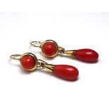 A PAIR OF VICTORIAN 9CT GOLD AND CORAL DROP EARRINGS With pear cut drops. (approx 3.5cm) (approx