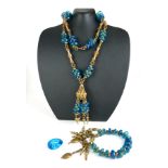 A VINTAGE PERSIAN GILT BRASS AND BLUE GLASS COSTUME JEWELLERY SUITE Comprising a filigree necklace