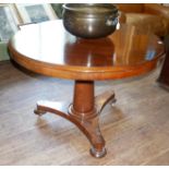 A VICTORIAN MAHOGANY CIRCULAR BREAKFAST TABLE Raised on a single column on a platform base.