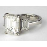 A RARE AND IMPRESSIVE 18CT WHITE GOLD THREE STONE NATURAL DIAMOND RING THE CENTRAL STONE 8.30CARATS,