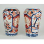 A PAIR OF JAPANESE IMARI PORCELAIN VASES Ovoid form with hand painted decoration (approx 24cm)