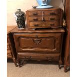 A DUTCH OAK CABINET With fall front above single drawer, on cabriole legs. (84cm x 43cm x 76cm)