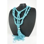 A VINTAGE TURQUOISE BEAD NECKLACE Rope twist design with glass beads to base. (approx 90cm)