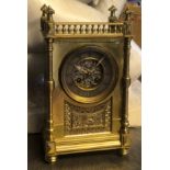 A 19TH CENTURY FRENCH BRASS CHIMING MANTEL CLOCK With turned gallery above a silvered dial centred