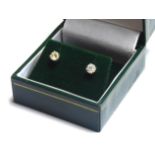 A PAIR OF 18CT GOLD AND DIAMOND STUD EARRINGS Each set with a round cut diamond. (approx total