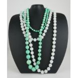 TWO VINTAGE HARDSTONE NECKLACES Comprising a single strand of spherical beads and a strand of
