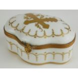 A 19TH CENTURY CONTINENTAL PORCELAIN AND GILT METAL OVAL TRINKET BOX With gilt cartouche of