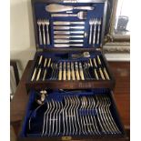 AN EARLY 20TH CENTURY OAK CASED CANTEEN OF SILVER PLATED CUTLERY Six place setting to include fish