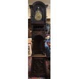 AN EARLY 20TH CENTURY DUTCH 8 DAY HEAVILY CARVED OAK LONG CASE CLOCK With engraved brass dial