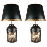 A LARGE PAIR OF BLACK CYLINDRICAL FORM TOLEWARE LAMPS Decorated with a coat of arms, complete with