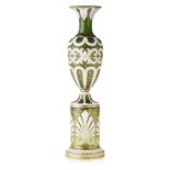 A 19TH CENTURY BOHEMIAN WHITE OVERLAID GLASS VASE AND STAND The vase with everted neck and