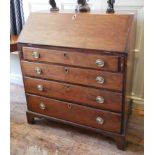 A GEORGIAN MAHOGANY FALL FRONT BUREAU With fitted interior above four long graduated drawers, raised