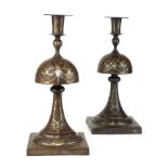 A PAIR OF FINE ANTIQUE PERSIAN METAL DARK PATINATED CYLINDRICAL CANDLESTICKS Elaborately inlaid with