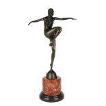 AFTER J. PHILLIP, A LARGE ART DECO STYLE BRONZE STATUE OF A DANCING GIRL On a red marble plinth