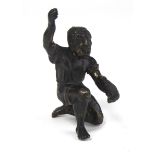 A 19TH CENTURY BRONZE KNEELING FIGURE OF AN AFRICAN SLAVE Having one arm raised and clutching a