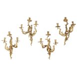A SET OF FOUR 19TH CENTURY LOUIS XV STYLE GILT BRONZE WALL LIGHTS In Rococo style, each with three