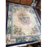 A FINE CHINESE WOOLLEN RUG OF CARPET PROPORTIONS The central cartouche centred with peacocks and