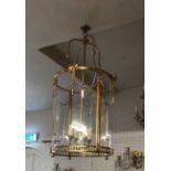 A LARGE PAIR OF BRASS HANGING CIRCULAR LANTERNS With classical swags, bow decoration and bowed class