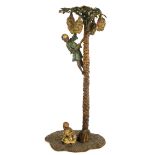AFTER BERGMAN, A COLD PAINTED BRONZE Modelled with two Arabesques boys beneath a palm tree,