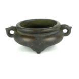 A SMALL CHINESE BRONZE TWIN HANDLE GLOBULAR CENSOR Bearing character mark. (w 14cm x h 5.5cm)