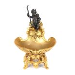 A GILT AND PATINATED BRONZE BOWL Classical design, figured with a winged cherub, signed. (19cm)