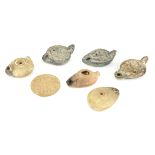 A COLLECTION OF SIX ROMAN/BYZANTINE POTTERY OVAL OIL LAMPS With incised and cast decoration,