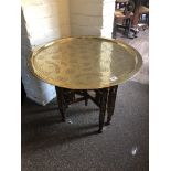 A LATE 19TH/EARLY 20TH CENTURY BRASS TOP ISLAMIC BENERES CIRCULAR TABLE With fine engraved