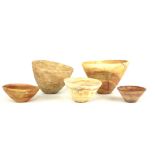 A COLLECTION OF FIVE BALTERAN CARVED ALABASTER BOWLS Dating approximately 1000BC and graduating