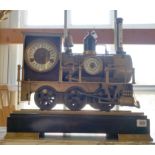 A 20TH CENTURY INDUSTRIAL STYLE BRONZE LOCOMOTIVE AUTOMATON CLOCK. (w 46cm x d 23cm x h 46cm)