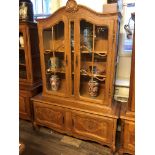 AN EARLY/MID 20TH CENTURY DUTCH OAK BOOKCASE/DISPLAY CABINET The shaped pediment centred with a