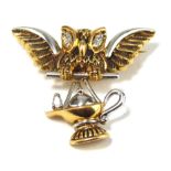 A VINTAGE 18CT GOLD, PLATINUM AND DIAMOND OWL BROOCH Modelled as an owl carrying a Persian lamp, set