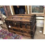 A VICTORIAN PINE DOME TOP TRAVEL TRUNK Having metal stapwork and leather cladding. (approx 87cm x