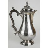 A CHESTER SILVER BALUSTER COFFEE POT With carved wooden handle, hallmarked George Nathan and