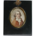 A 19TH CENTURY OVAL MINIATURE PORTRAIT OF A GENTLEMAN Wearing a red coat and white tie. (11cm)