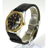 RADO, VOYAGER, A VINTAGE STAINLESS STEEL GENT'S WRISTWATCH Having a gold plated bezel, black dial