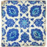 A 16TH CENTURY OTTOMAN PERIOD IZNIK EARTHENWARE SQUARE TILE Painted with rosettes of flowerheads, in