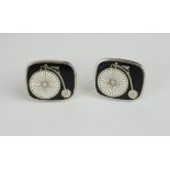 A PAIR OF GILT METAL AND ENAMEL FILM MEMORABILIA RECTANGULAR CUFFLINKS With white enamel penny