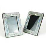 A PAIR OF STERLING SILVER AND ENAMEL ART NOUVEAU DESIGN PHOTOGRAPH FRAMES Organic form set with blue