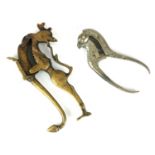 A 19TH CENTURY INDIAN WHITE METAL NUT CRACKER IN THE FORM OF A BIRD Along with another in bronze,