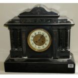 A VICTORIAN BELGIUM MARBLE MANTLE CLOCK With chiming movement, along with two Portuguese statues