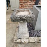 A 19TH CENTURY CARVED STONE BIRD BATH The square top raised on a square plinth with step base. (
