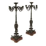 A 19TH CENTURY PAIR OF PATINATED BRONZE GRAND TOUR CANDELABRA With central electrified socles