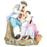 A 19TH CENTURY CONTINENTAL HARD PASTE PORCELAIN GROUP OF PASTORAL WATTEAUESQUE LOVERS IN A GARDEN