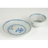 AN 18TH CENTURY CHINESE NANGKING CARGO BLUE AND WHITE PORCELAIN TEA BOWL AND SAUCER Hand painted