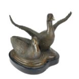 A BRONZE FIGURAL GROUP OF MALLARD DUCKS One bird having outstretched wings, on a black marble