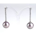 AN 18CT GOLD, PEARL AND DIAMOND DROP EARRINGS Each earring set with nine round cut diamonds and