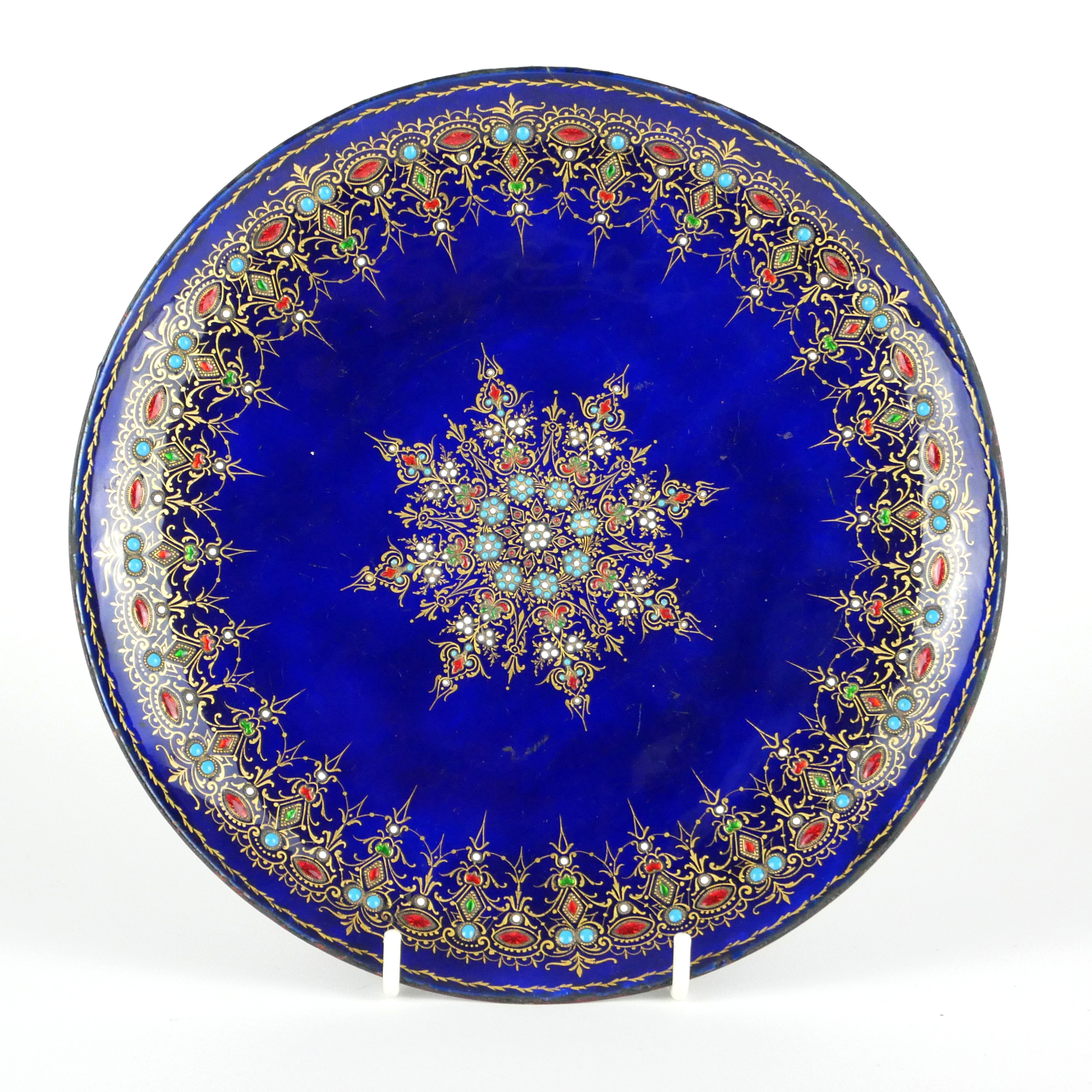 A 19TH CENTURY FRENCH LIMOGES ENAMELLED COPPER DISH Decorated with a central star-form motif